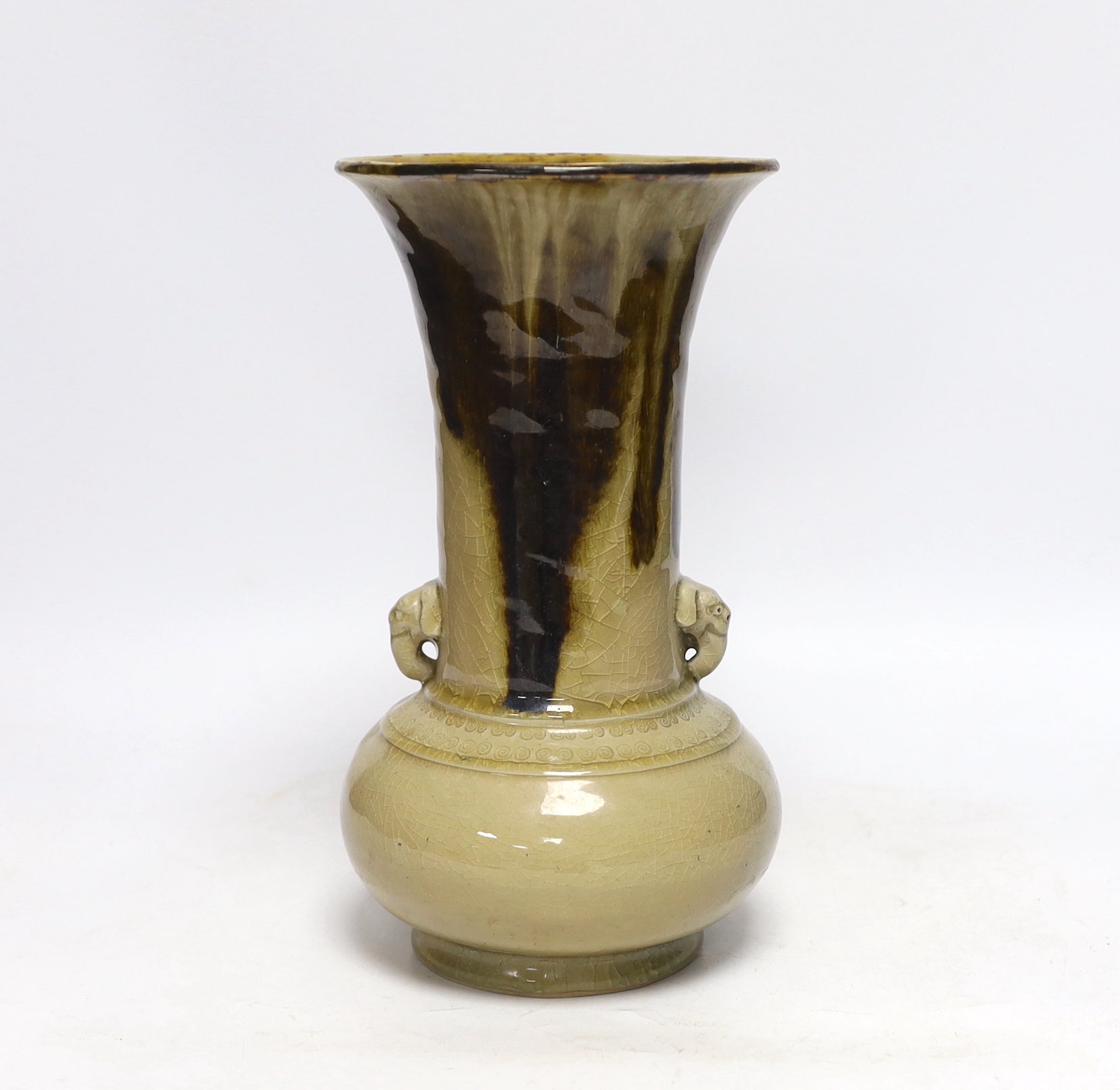 A Japanese celadon and brown glazed vase with mythical beast handles, 27cm